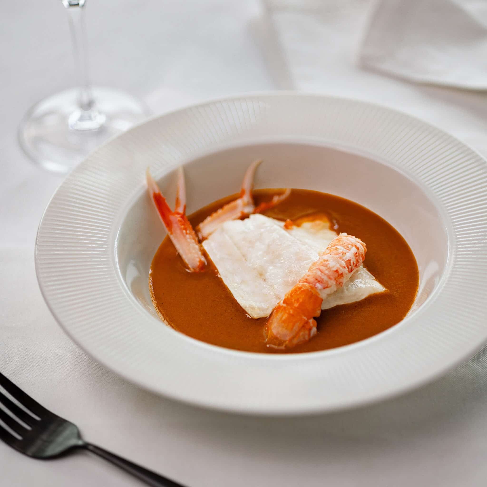 Recette Pavé de bar sur bisque de langoustine et tomate